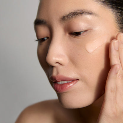 Model application showcasing the Tatcha Longevity Memory Cream