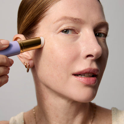Model application showcasing the Tatcha Serum Stick